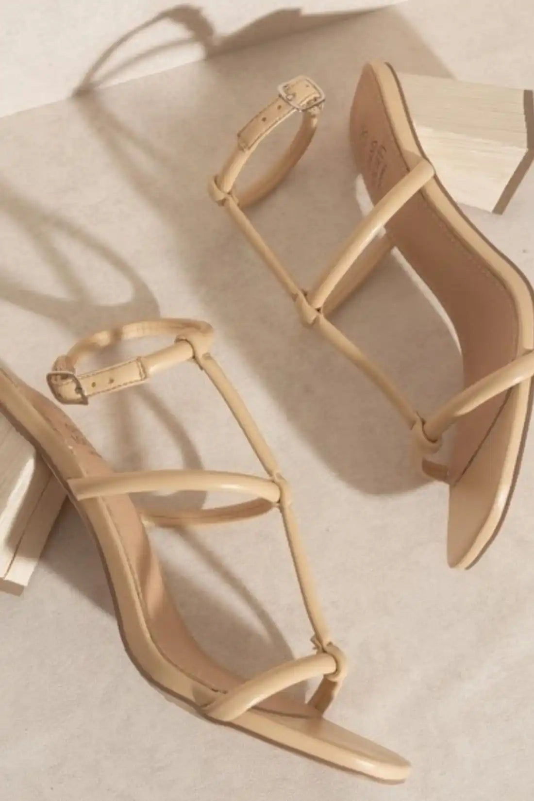 Beige heeled sandals.