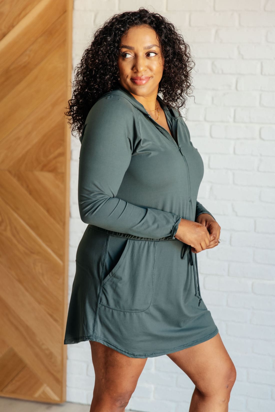 Getting Out Long Sleeve Hoodie Skort Romper in Smoked Spruce | Jumpsuits & Rompers