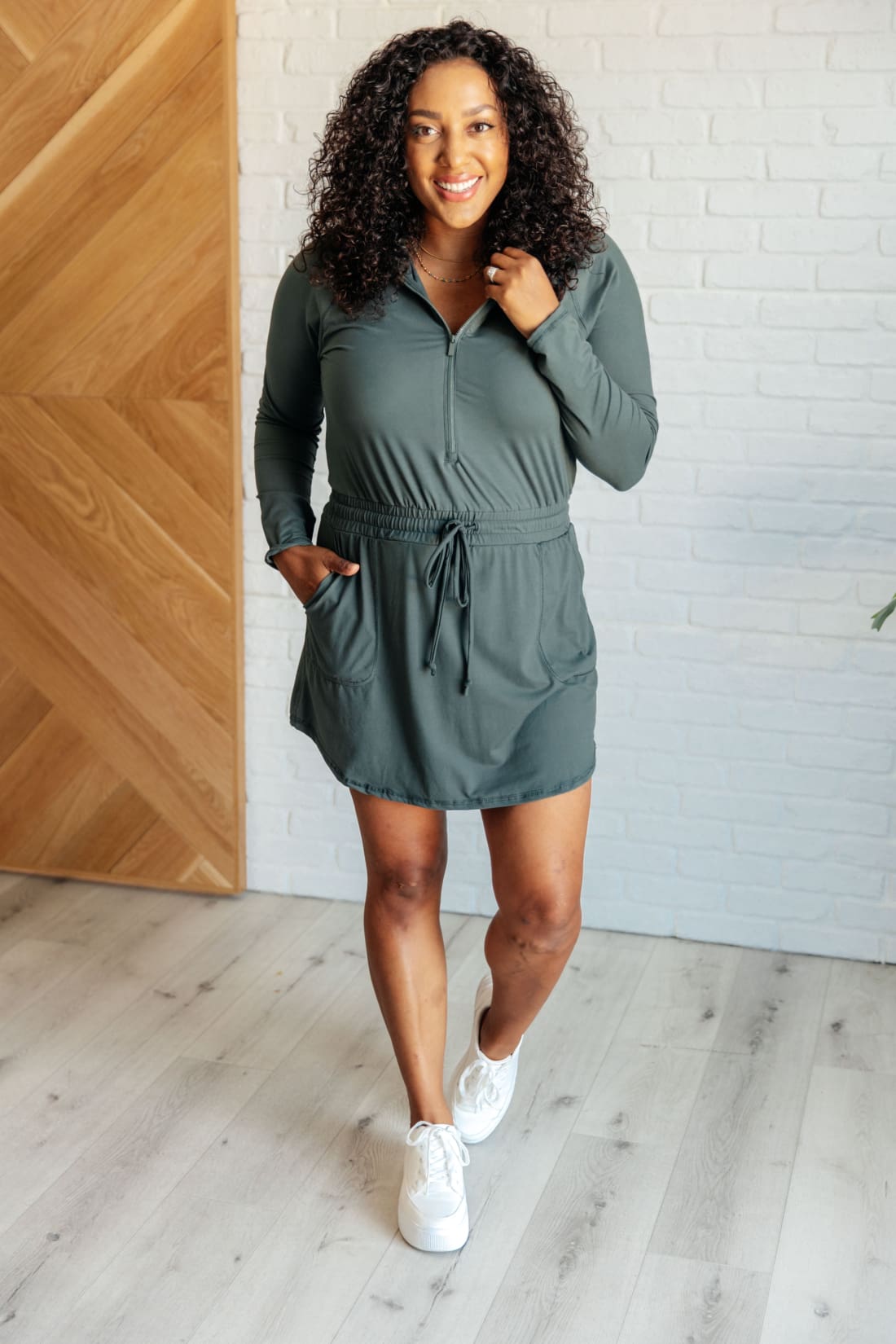 Getting Out Long Sleeve Hoodie Skort Romper in Smoked Spruce | Jumpsuits & Rompers